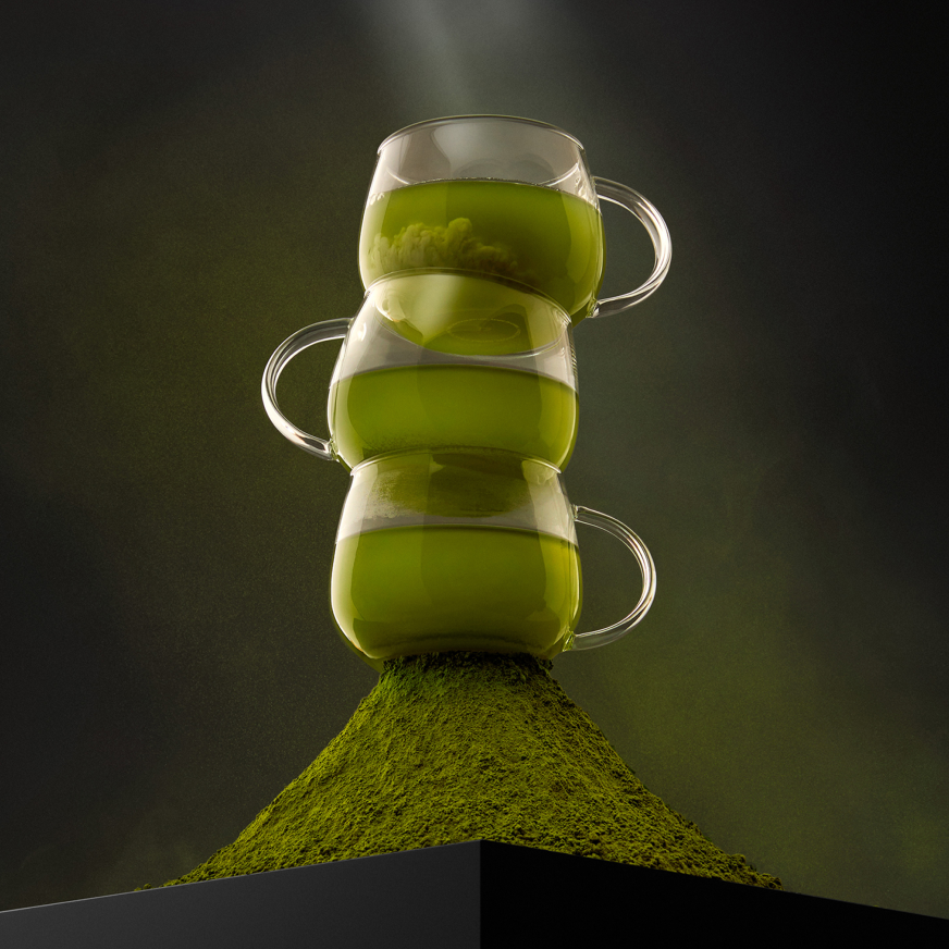 Three mugs filled with brewed matcha