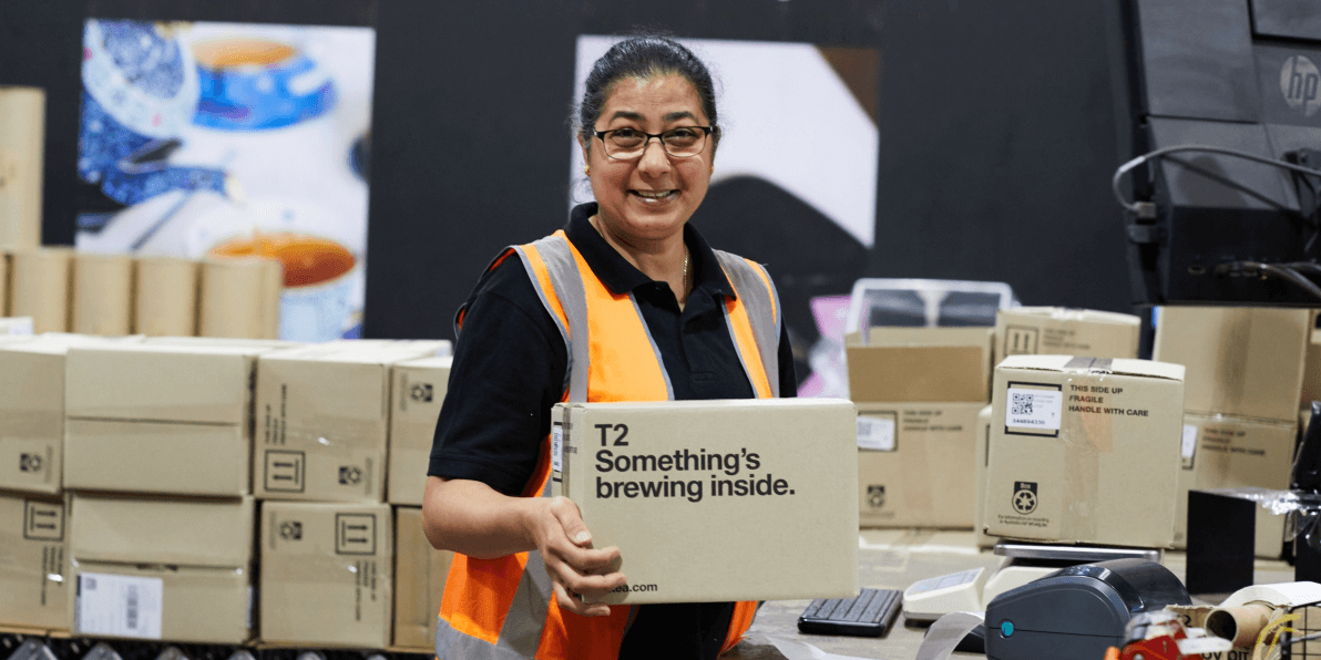 Close up detail of T2 tea on a wooden shelf