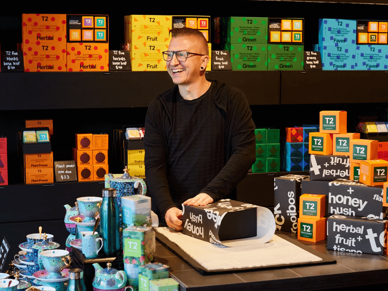 Close up detail of T2 tea on a wooden shelf