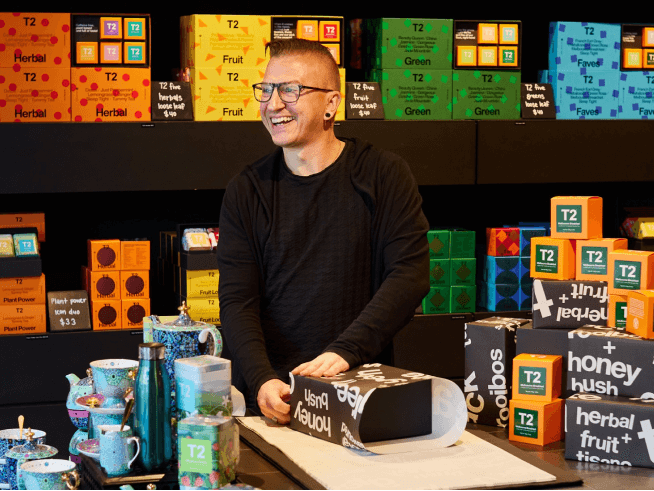 Close up detail of T2 tea on a wooden shelf