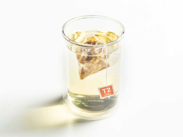 A cup and of Packs A Peach tea