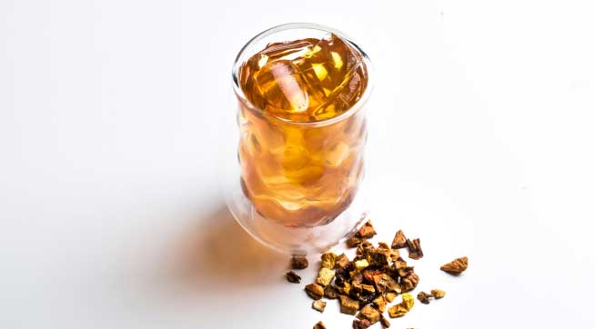 A cup and of Packs A Peach Tea