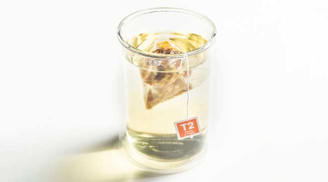 A cup and of Packs A Peach Tea