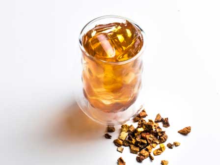 A cup and of Packs A Peach Tea