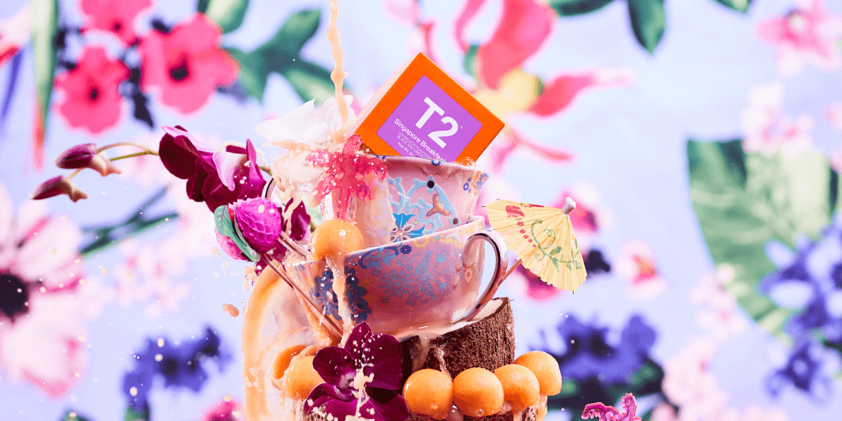 Small stack of T2 tea cups, t2 products sitting inside a coconut shell