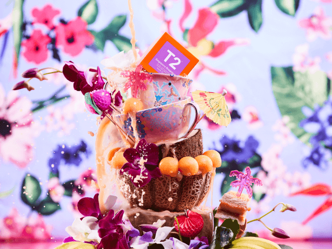 Small stack of T2 tea cups, t2 products sitting inside a coconut shell