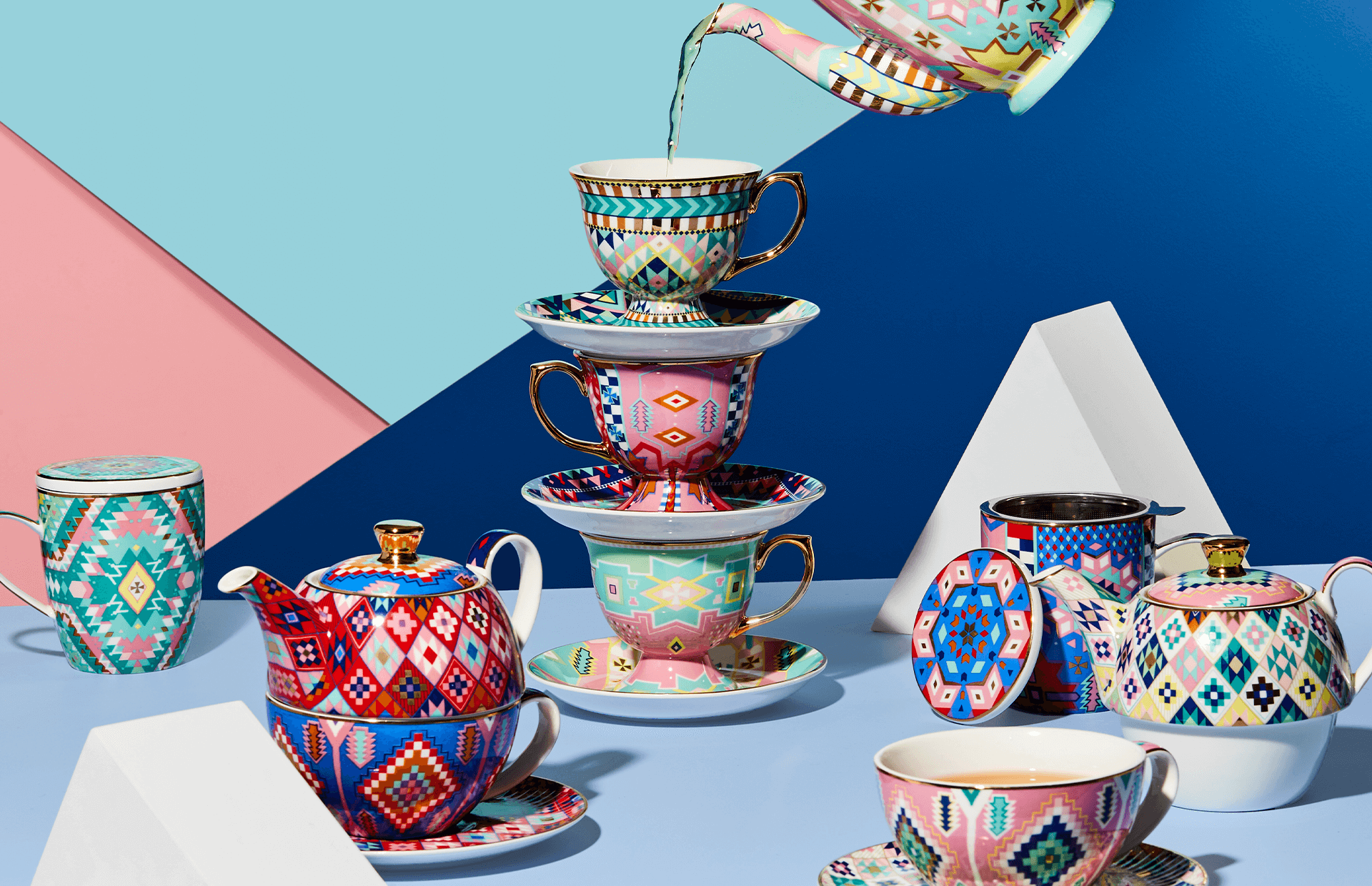 Bright and Colourful teacups with a bright geometric paper background